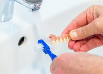 How Can You Properly Care for Your Dental Prosthetics Beyond Brushing?
