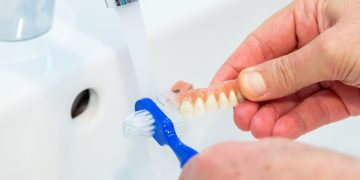 How Can You Properly Care for Your Dental Prosthetics Beyond Brushing?