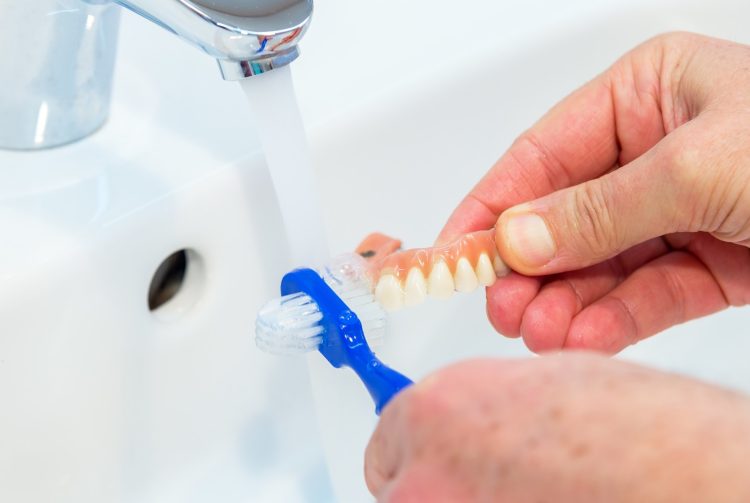 How Can You Properly Care for Your Dental Prosthetics Beyond Brushing?